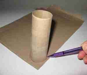 Set the cardboard tube on some paperboard (like a cereal box) and trace around the bottom.